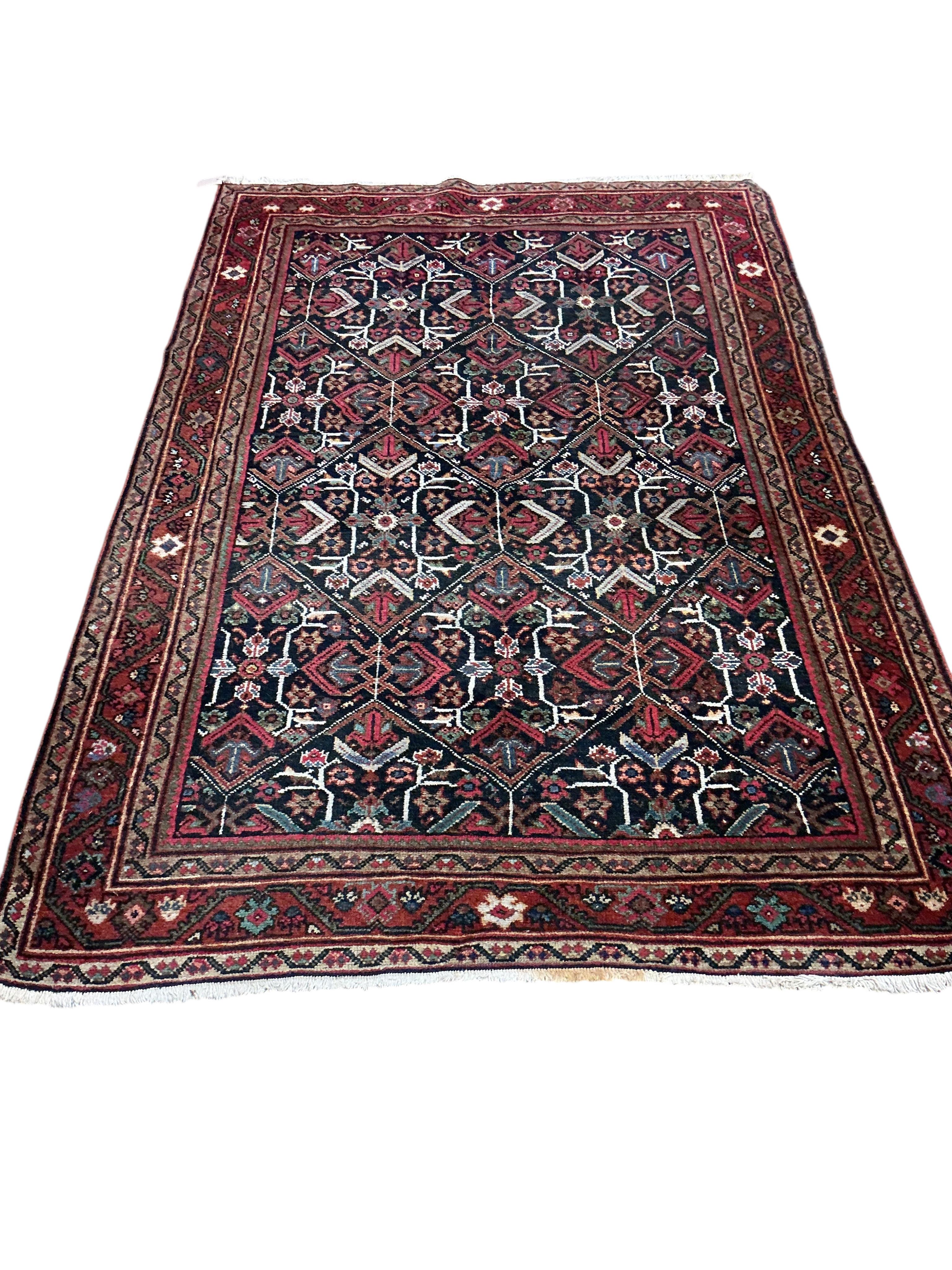 A North West Persian blue ground geometric rug, 210 x 140cm